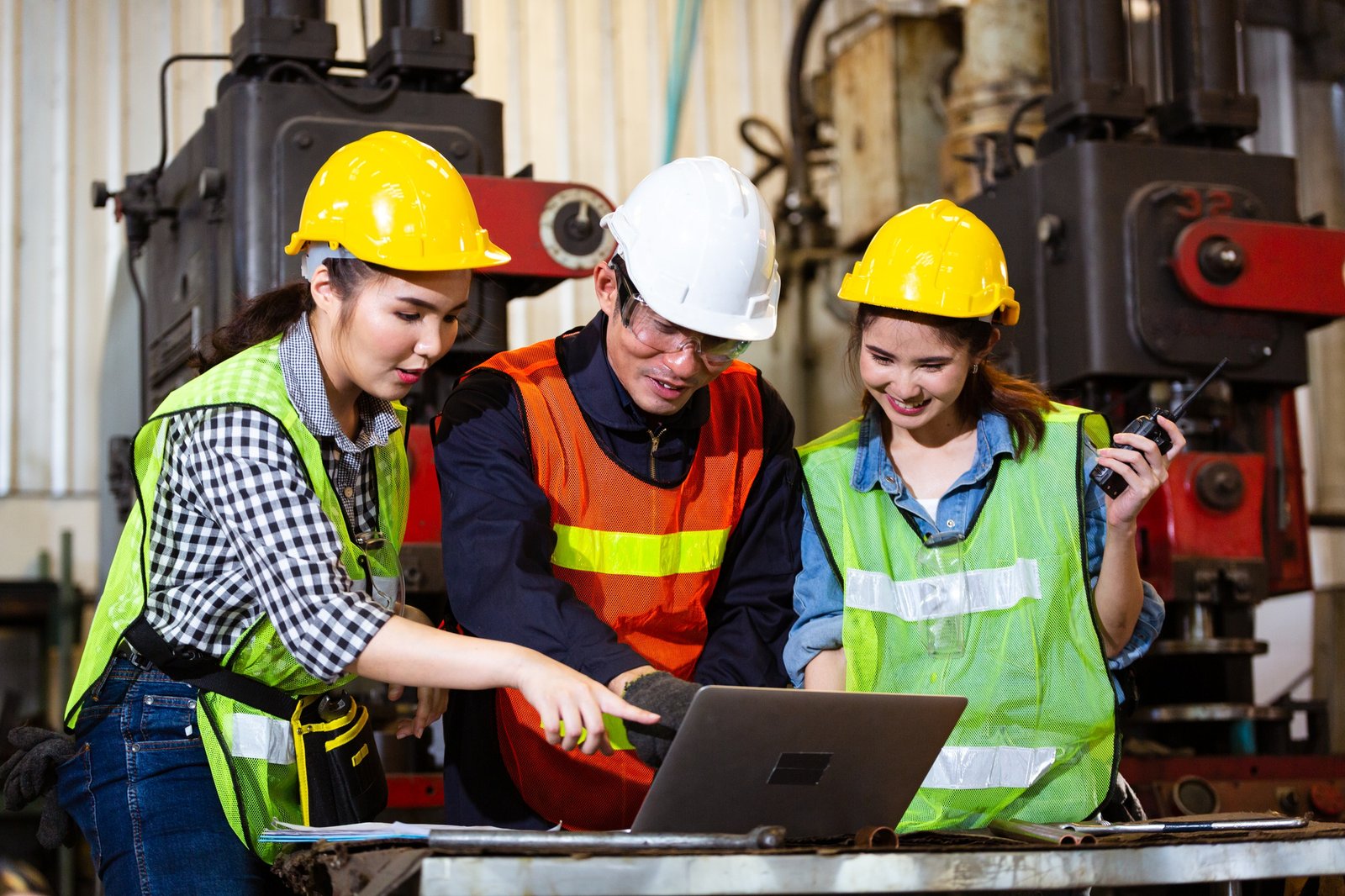 Asian engineer training trainee working in industrial factory